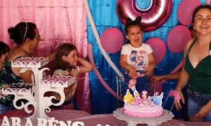 Sisters Fighting to Blow Out the Birthday Candle