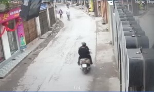 Lady on Moped Drops her Baby Near Oncoming Truck