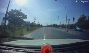 Speeding Car Spins Out Down Road