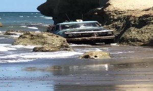 Load Carrying Truck Emerges from Ocean