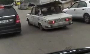 Small Car Carries Huge Cab
