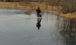 Man Ice Skating Finds Slim Spot in the Ice