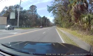 Turning Tow Truck Loses Load