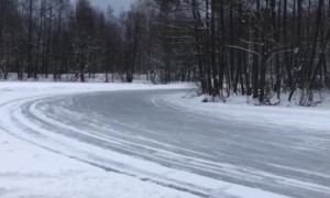 Group of Cars Slide Around Icy Corner