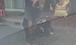 Moped Rider Coasts Down Street Using Only His Feet