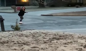 Girl Blissfully Ice Skates around Neighborhood