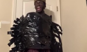 Guy Duct Taped to Door Takes a Tumble
