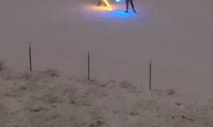 Two Men Having a Light Saber Duel in the Snow