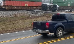 Stranded Truck Sliced in Two by Train