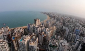 Paraglider Lands by Rooftop Pool for a Swim
