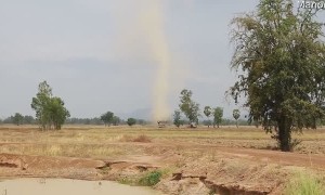 Tall Whirlwind Travels Through Field
