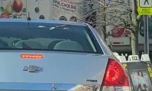 Semi Smashes Parked Car While Reversing