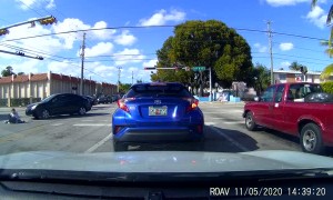 Car Knocks Pedestrian off Her Feet