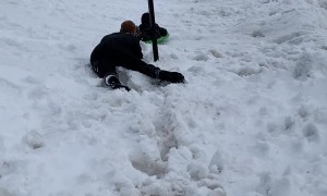 Guy Intercepts Sledding Kiddo from Pole