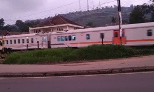 Motorcyclist Has Close Call with Oncoming Train