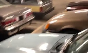 Guy Walks into Parking Garage Full of Retro Vehicles