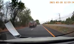 Motorist Narrowly Avoids Fallen Pipe from Truck
