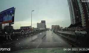 Slippery Corner Sends Car Bouncing Between Barriers