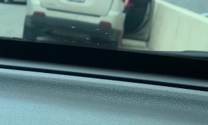 Vehicle Whacks Freeway Wall