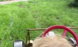 Boy Takes Dad for a Tour in Miniature Model T