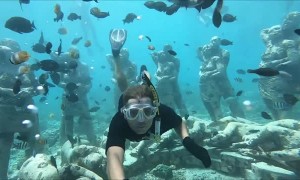 Couple Snorkel Together Through Famous Underwater Statues