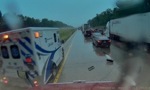 Ambulance Driver Clips Truck Mirror during Response