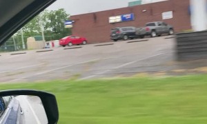 Employees Mop Up Parking Lot