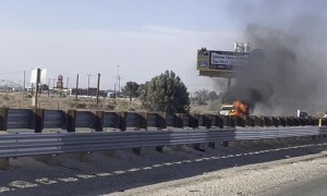 Car Parked in Emergency Lane Engulfed in Flames