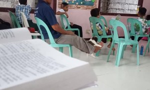 Guy in Church Swings Puppy with His Feet
