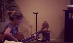 Little girl with angelic voice sings with her mommy 