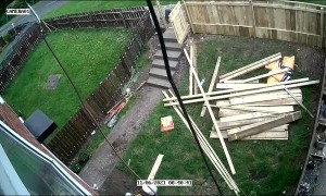 Guy Tearing Down Fence Takes a Tumble