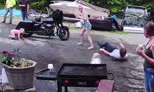 Guy Fleeing Water Gun Fight Knocks Over Two Kids