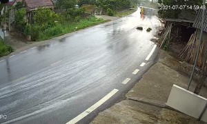 Speeding Truck Tips Over on Slippery Road