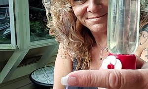Hummingbird Eating From Lady's Hand in Slow Motion