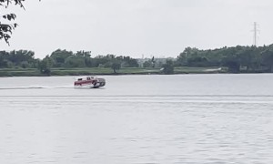 Pickup Truck Vessel Cruises Across Lake
