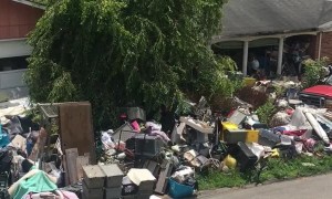 House Blocked by Mountain of Junk