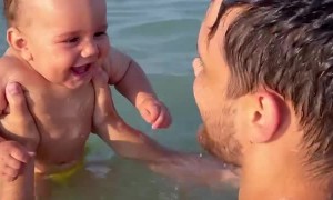 Beachgoing Baby Belly Laughing