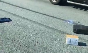 Cop Car Spills Contents into Street