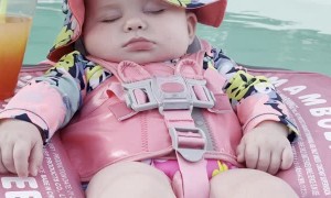 Baby Relaxes in Pool