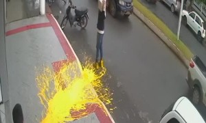 Dropping a paint bucket on the sidewalk