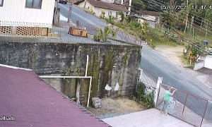 Car Overturns After Hitting Gate