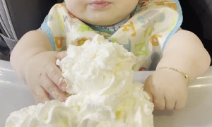 Baby Confused by First Encounter With Whipped Cream