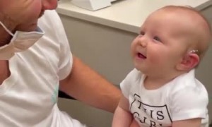 Baby girl hears for the first time and can't stop smiling about it