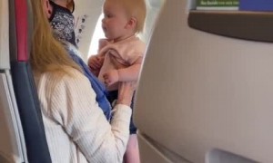 Stranger on airplane calms down crying baby