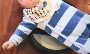 Baby Laying on a Roomba
