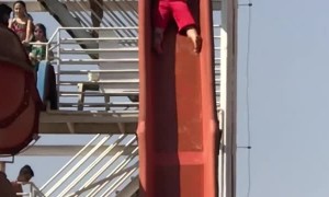 Guy on Slide Collides with Unsuspecting Swimmer