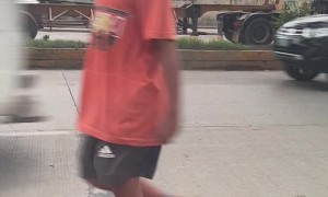 Man Uses Hand to Block Peeping Kid