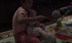 Sister Laughs Hysterically at Ball and Spoon Game