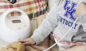 Toddler Feeds Doll With Pump