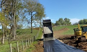 Dump Truck Back Spreading Gravel